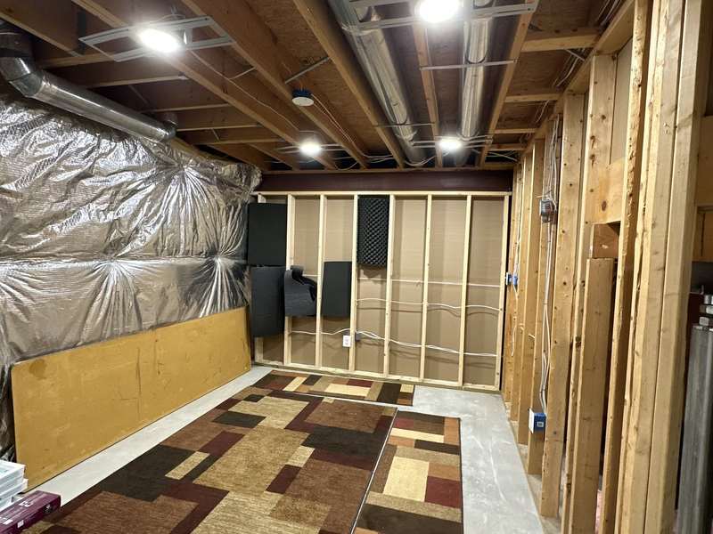 Framed basement with new recessed lights and rough-in wiring